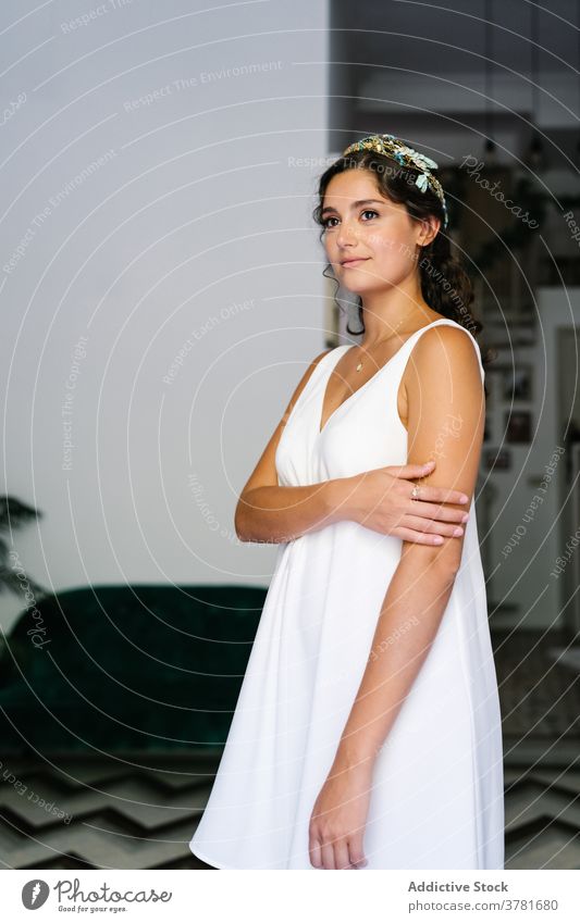 Elegant woman in dress looking away white grace elegant gentle delicate smile white dress romantic female modern calm style apartment relax serene peaceful home
