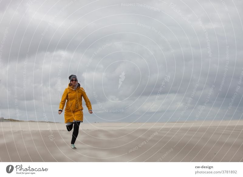 woman on the beach Woman Beach windy Ocean coast Sky youthful