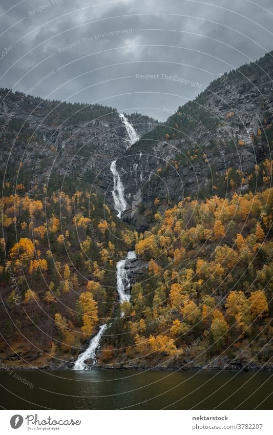 Kjosfossen Waterfall Flowing Between Autumnal Trees waterfall mountain autumn Norway north nature natural lighting outdoors scenery scenics landscape