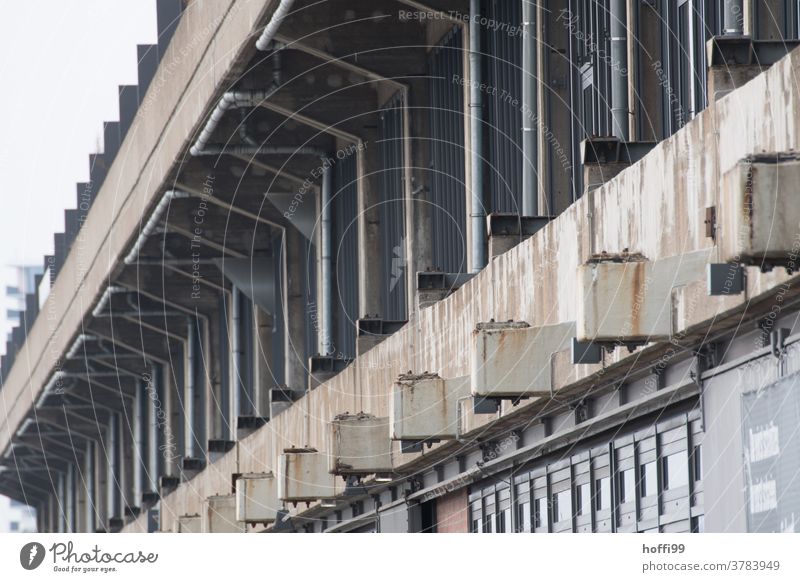 Exterior view of an old warehouse with traces of rust Warehouse Gloomy waiting zone 50s Harbour Logistics logistics Hall Flake Storage Industry Building Facade