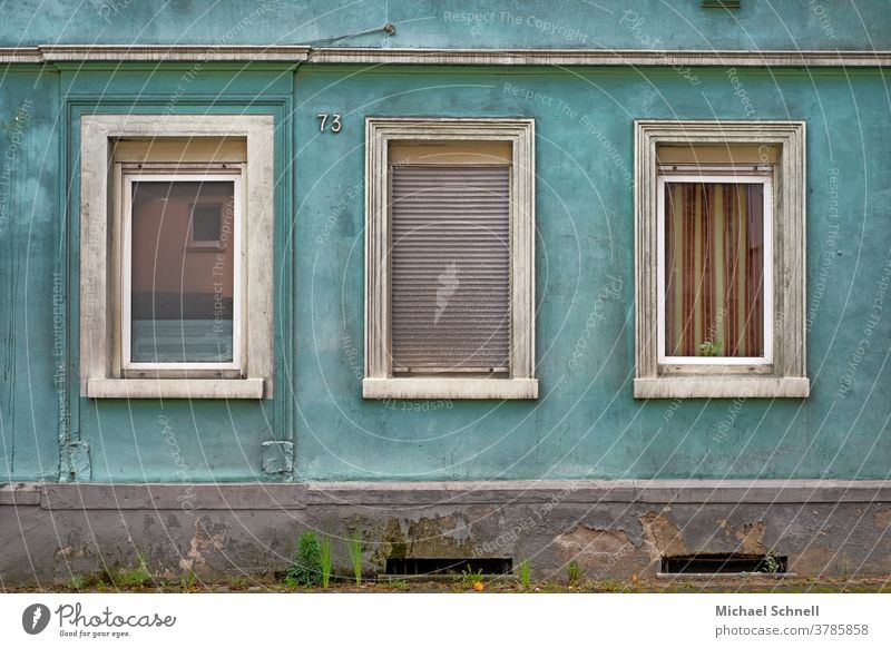 Triste house wall of an old house with three windows, one of them with closed shutters Wall (building) Facade Wall (barrier) Deserted Exterior shot Colour photo
