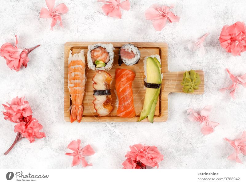 https://www.photocase.com/photos/3788942-sushi-set-nigiri-and-sushi-rolls-on-awooden-board-photocase-stock-photo-large.jpeg