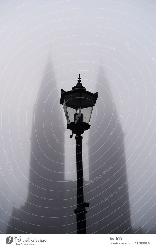 Street lamp in front of the fog-covered cathedral of Bremen Fog Misty atmosphere Shroud of fog Street lighting Dome Cathedral of Bremen Autumn autumn fog