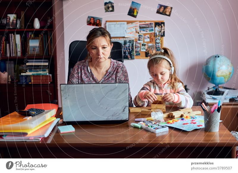 Little pre-school girl learns to solve puzzles online and plays educational  games on tablet at home - a Royalty Free Stock Photo from Photocase