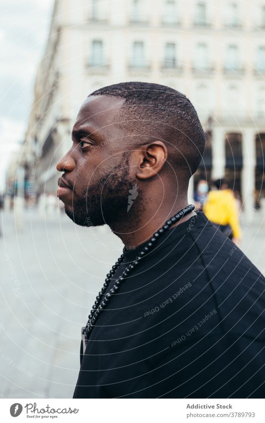 Portrait of serious black man looking away male urban person portrait american adult african face people handsome young casual confident modern attractive city