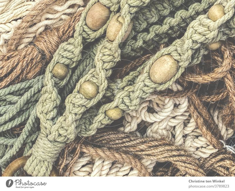 View from above on several parts macramé with wooden balls Macramé Lichen knot ropes tapes String Pattern Rope hobby Knot natural-coloured Handcrafts Green