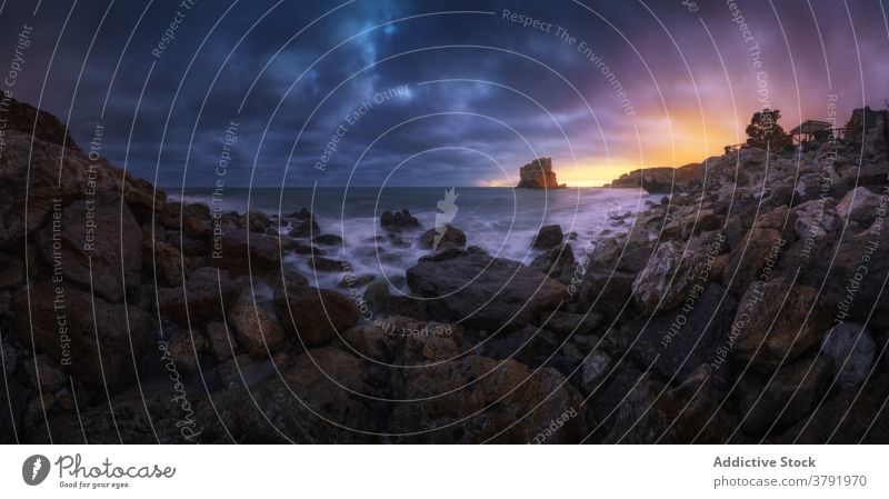 Scenery of sea and rocky shore at sunset sky seascape boulder breathtaking scenic sundown iceland nature twilight tranquil water harmony ocean coast dusk