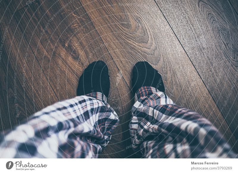 feet from above on wooden floor in pajamas background blue casual closeup cozy drawn fairy fashion food foot footwear home legs lifestyle living room modern