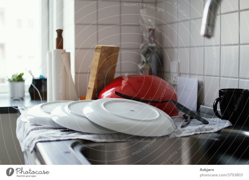 Clean dishes on counter Kitchen dishes stacked clean Do the dishes Household Cleaning Housekeeping messy real Authentic Kitchen sink Close-up