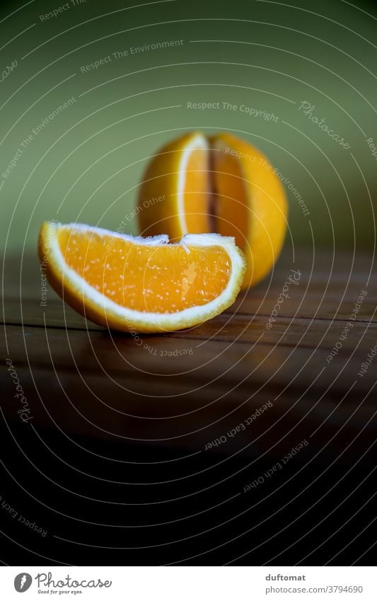 Orange and orange slice on wooden table Vitamin Nutrition Food Healthy Fruit Vitamin C Organic produce Vegetarian diet Healthy Eating Food photograph