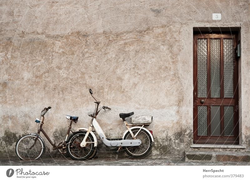 Rusting together Italy Village Small Town Old town House (Residential Structure) Building Wall (barrier) Wall (building) Facade Door Vehicle Motorcycle Bicycle