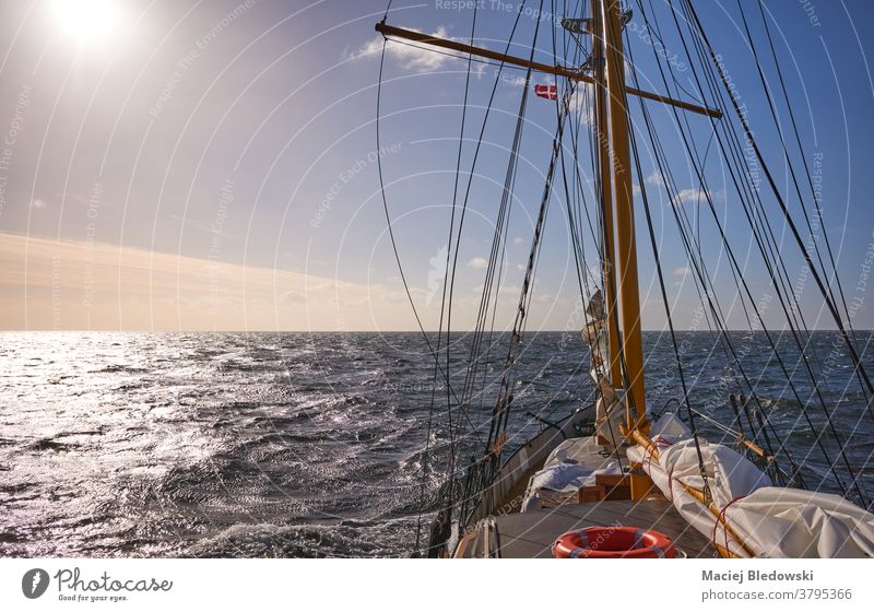 Sailing old schooner at sunset, travel and adventure concept, sailing ship water cruise freedom wave sea lifestyle horizon boat wind ocean mast transport view