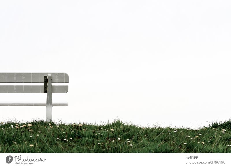 Partial view of a bank on the dike dike top Seating bench Bench dike grass Grass Dike Daisy Loneliness Relaxation Calm Sky Break Clouds Sit Meadow Nature Green