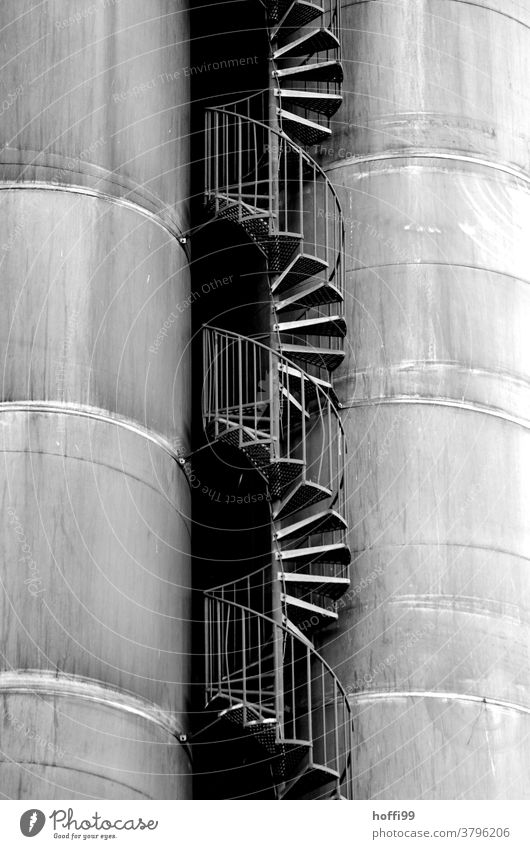 Stairs between the tanks Winding staircase Industrial plant Curve Industry Storage shed Gasometer Harbour Energy industry Silo Banister Gas tank Oil tank Facade
