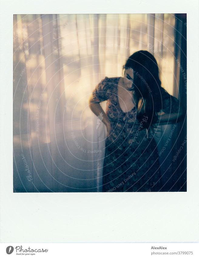 Polaroid- Portrait of a young woman in front of a hotel window portrait Woman pretty Near fit daintily Skin Face look Direct Long-haired Athletic youthful