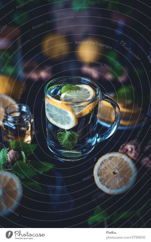 Hot brewed lemon with mint and ginger Beverage Lemon Glass Fresh Drinking Cold and flu cold remedies Homespun remedy Mint Honey Syrup Slice of lemon Green