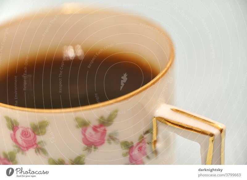 Mocha in a traditional mocha cup with gold rim and flower pattern of fine porcelain detail Coffee Pattern Close-up Espresso background Cup Beverage