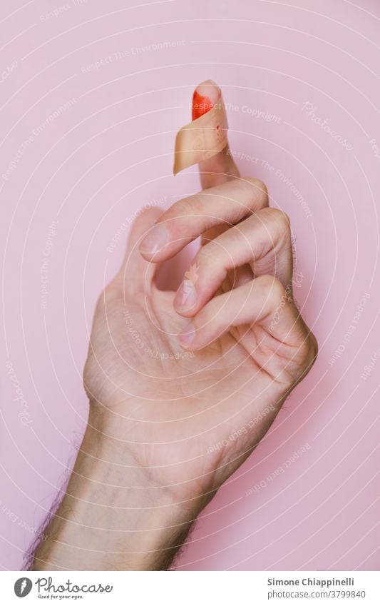 Bloody finger with patch on pink background Hand Pink Colour photo Red Neutral Background Hurt Wound Fingers Skin Pain Detail care Patch Health care health