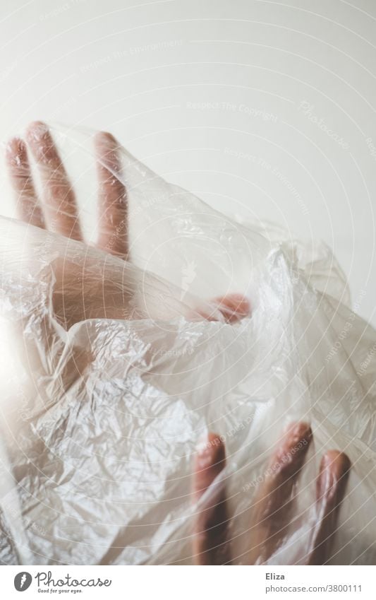 Hands | trapped in plastic Plastic Woman Recycling Captured Anguish Packaging Body Face Plastic packaging Environmental pollution Trash Problem Plastic bag
