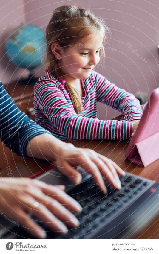 Little pre-school girl learns to solve puzzles online and plays educational  games on tablet at home - a Royalty Free Stock Photo from Photocase