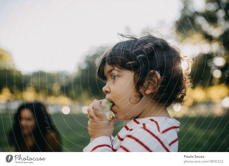 Child eating apple outdoors Caucasian 1 - 3 years people Healthy Eating Fruit Colour photo Infancy Food Nutrition Human being Toddler Multicoloured