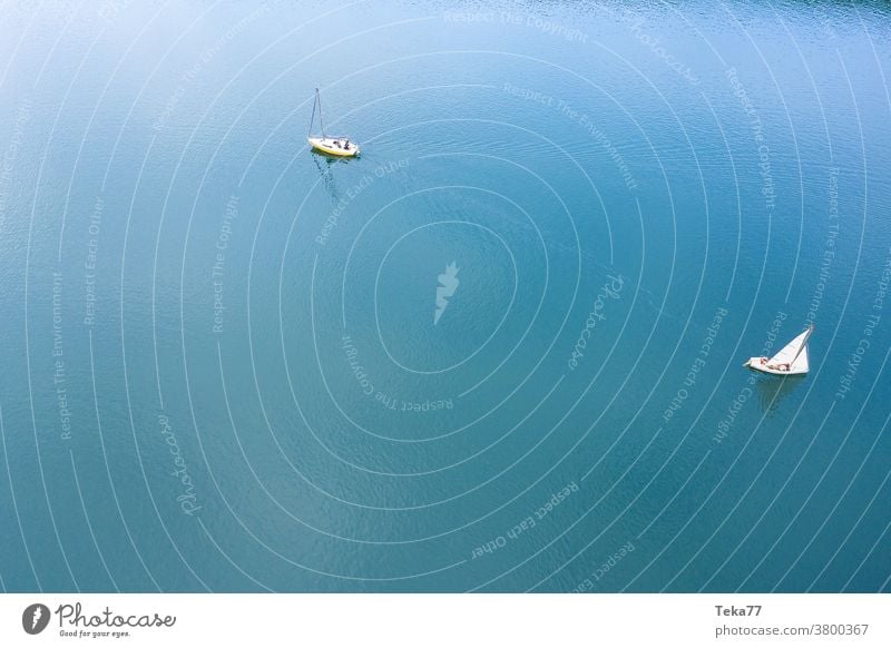 two sailing ships from above sports harbor sport boat harbor boats from above water white waves water sports swimming