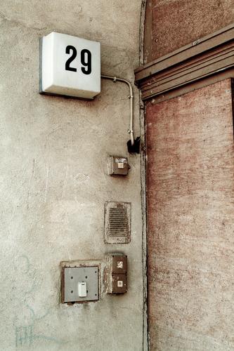 House entrance number 29 House number Entrance House (Residential Structure) door front door Doorbell Light switch Apartment Building Old Derelict Facade