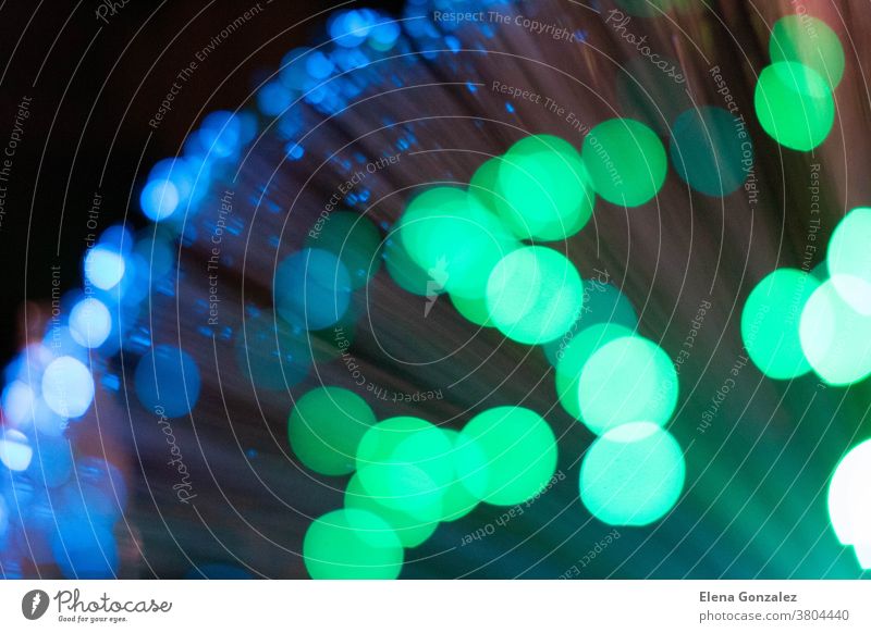 bokeh background with colored lights blue and green design abstract defocused magic feast night glitter glittering elegant space smooth glow festive magical