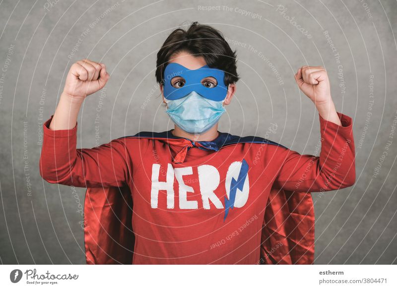 Coronavirus,kid with medical mask dressed as a superhero coronavirus child covid-19 epidemic pandemic quarantine stay home 2019-ncov happy happiness lifestyle
