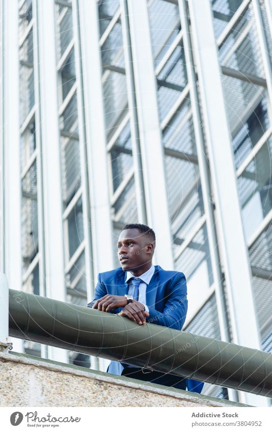 Stylish executive black man in suit in downtown businessman confident formal urban respectable modern success elegant manager professional adult male