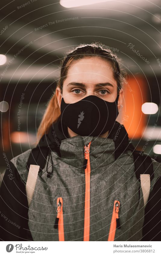 Woman with face mask in jacket portrait - a Royalty Free Stock Photo from  Photocase