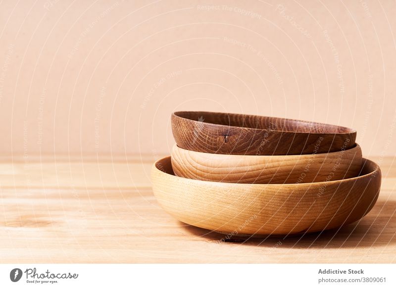 Wooden bowls in studio plate wooden still life copy space object minimal composition kitchen utensil pastel household board empty nobody brown texture table