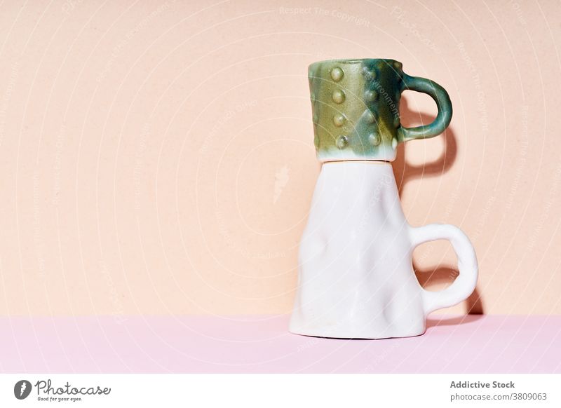 Handmade ceramic cups at studio clay handmade minimal still life composition kitchen utensil pastel design crockery object tea container porcelain mug espresso