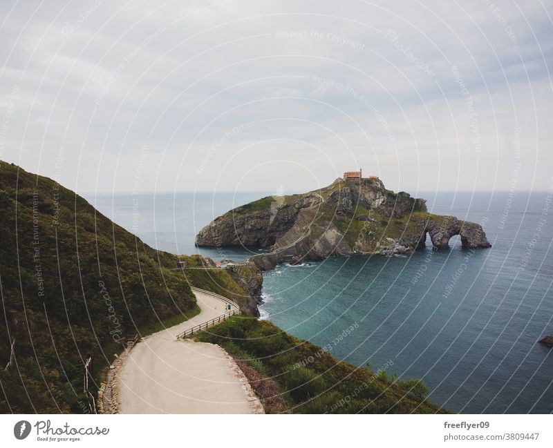 Gaztelugatxe Island in Bilbao, Spain lone rock giant cliff beach nature sharp vizcaya basque country copy space coast travel stone high water view ocean