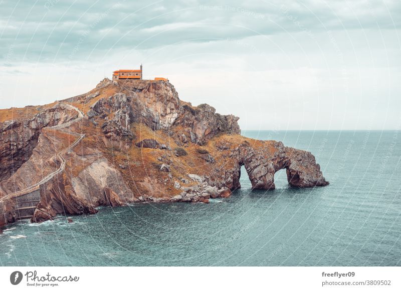 Gaztelugatxe Island in Bilbao, Spain lone rock giant cliff beach nature sharp vizcaya basque country copy space coast travel stone high water view ocean