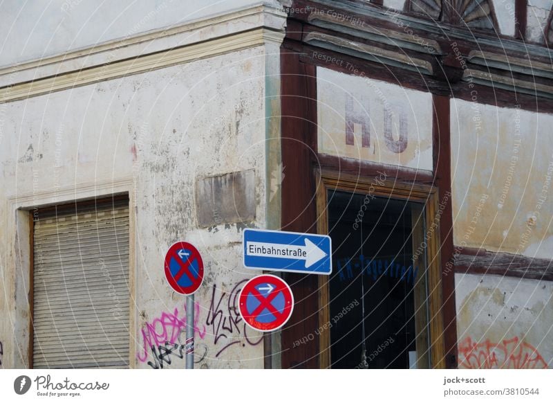 HO here and earlier ho Facade Past Old building Lettering Corner Road sign Authentic Weathered Half-timbered facade One-way street No standing roller shutter