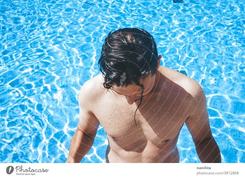 Portrait Of A Happy Attractive Muscular Man Posing In Swimming Pool Stock  Photo, Picture and Royalty Free Image. Image 67266922.