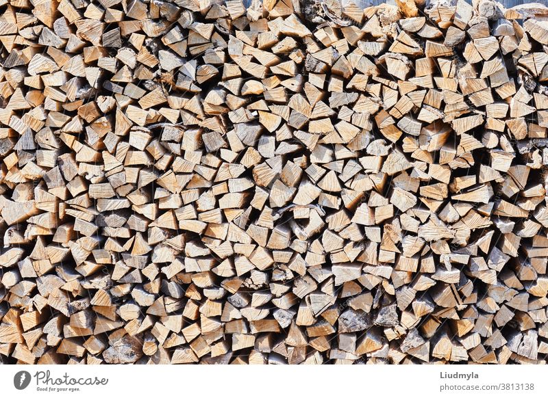 Stacks of firewood in the sawmill. Pile of firewood. Firewood background business chopped cords of firewood craft cut dry ecologic environment factory
