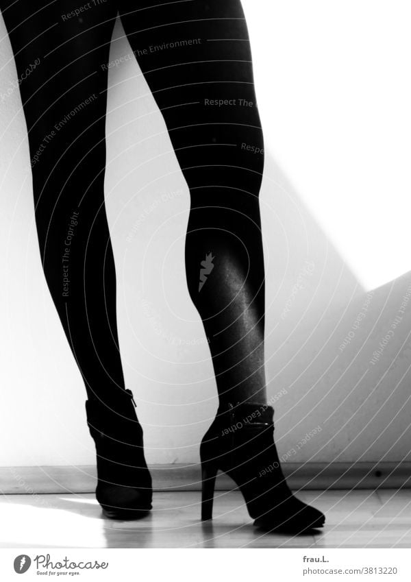 Balancing legs on murderous high heels. Woman bootees Tights Legs feet Women's legs