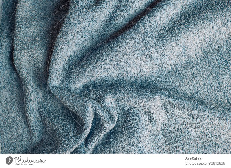 Top view of a light blue towel with some wrinkles blanket material background pattern fuzzy fleece white warm design plush texture cream soft textile fur clean