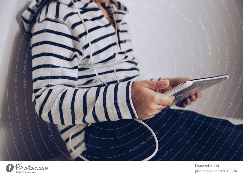 Little pre-school girl learns to solve puzzles online and plays educational  games on tablet at home - a Royalty Free Stock Photo from Photocase