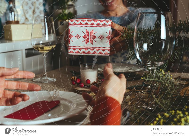 Happy family opening christmas presents, sisters give each other gifts at the  christmas table, Family Together Christmas  Concept. women´s together home happy