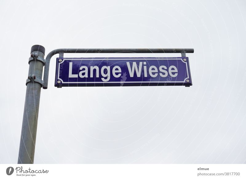 freestanding street sign "Lange Wiese street name Name writing designation Signs and labeling Letters (alphabet) Signage Characters letter Metal decoration