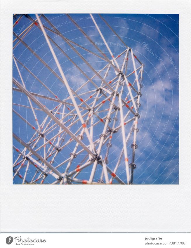 Scaffolding in front of a blue sky on Polaroid pole poles Construction Construction site Exterior shot Sky Deserted Colour photo