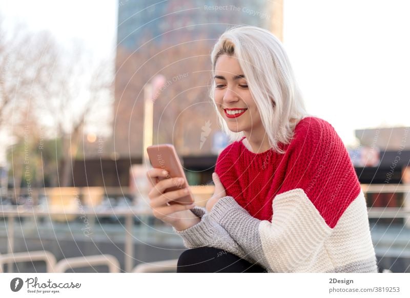 Close up portrait of beautiful young woman using cellphone outdoors in the city smartphone 1 smiling holding happiness standing street happy female mobile girl