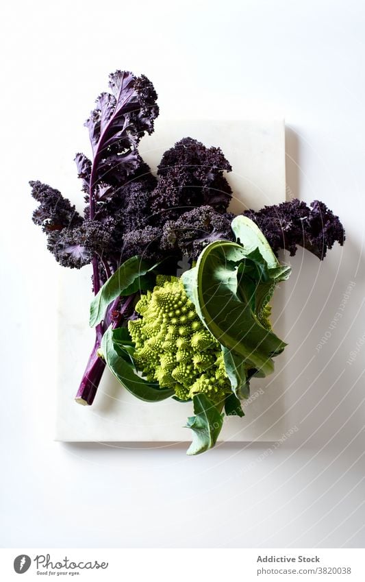 Red or purple kale leaf vegetable romanesco cabbage cauliflower organic plant raw closeup food ingredient agriculture fresh broccoli healthy autumn green