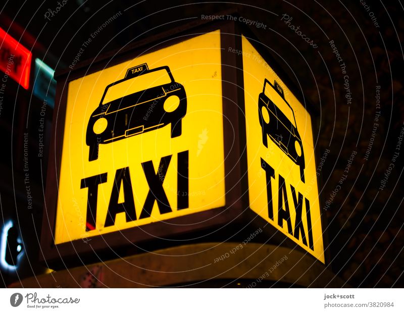 Taxi Taxi call box Berlin free of charge Site Taxi call point Mobility Lightbox Illuminate Pictogram Word Artificial light Yellow Night Design Square Services