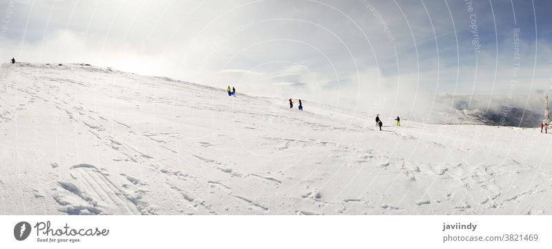 People having fun in snowed mountains in Sierra Nevada winter nevada sierra sky spain europe nature tourism vacation travel andalusia holiday landscape outdoor