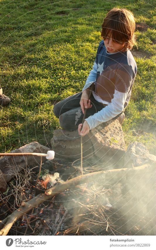 Child at campfire grilling marshmallows foam sugar Delicious cute BBQ Smoke Fireplace Boy (child) Parenting Childhood memory Infancy Nature be out country lust