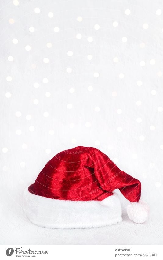 Merry Christmas.Red santa hat isolated over Christmas lights christmas santa claus fun celebration Christmas present christmas eve happiness joy happy